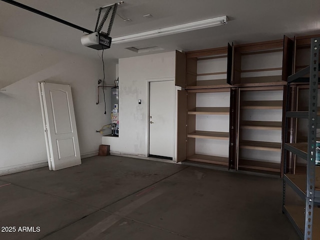 garage featuring a garage door opener and gas water heater