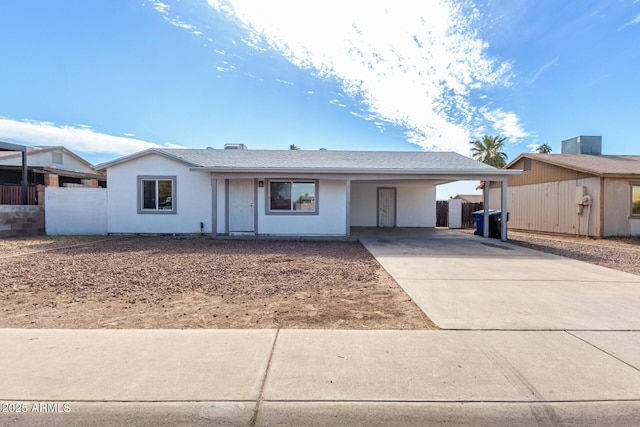 single story home featuring a carport