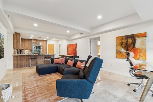living area with light tile patterned floors, baseboards, and recessed lighting