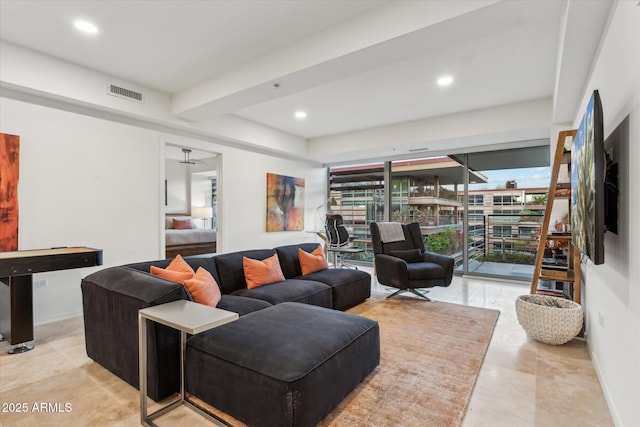 living area with visible vents and recessed lighting