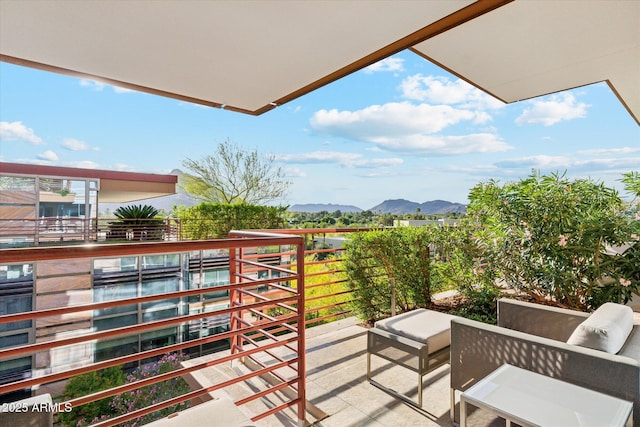 balcony with a mountain view and outdoor lounge area