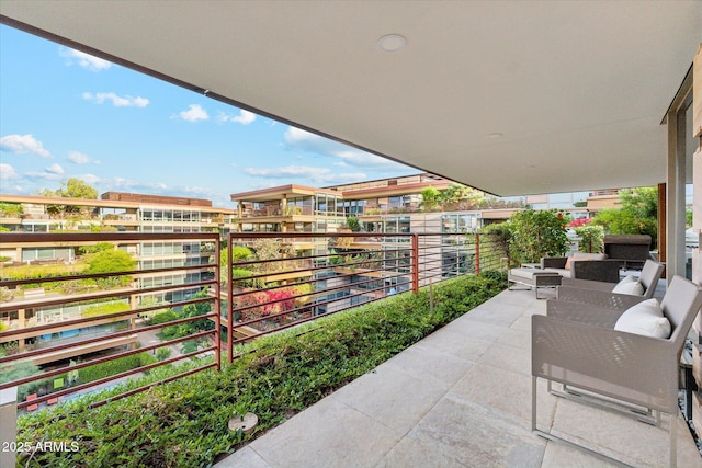 view of patio featuring a balcony