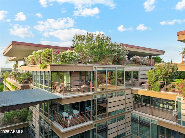 back of house with a balcony