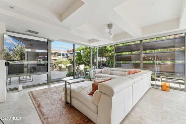 living area featuring a wall of windows, tile patterned flooring, and visible vents