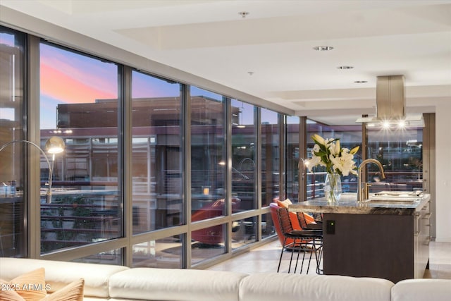 sunroom featuring a sink