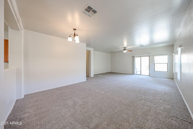 5418 W Carson Rd, Laveen, AZ 85339 - spare room with a chandelier, light colored carpet, and a ceiling fan