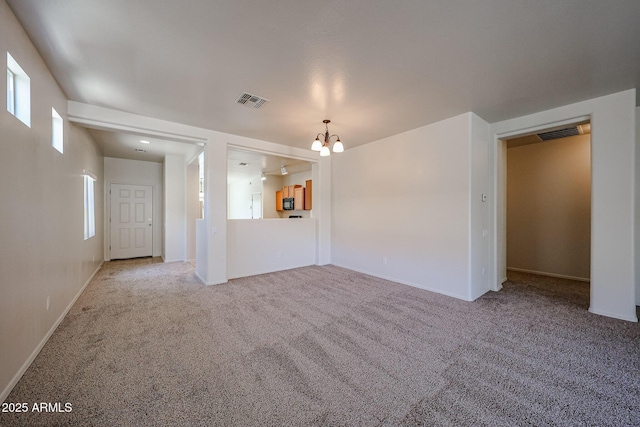 5418 W Carson Rd, Laveen, AZ 85339 - unfurnished living room with a chandelier and carpet floors