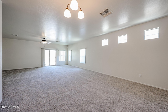 5418 W Carson Rd, Laveen, AZ 85339 - empty room featuring healthy amount of natural light, carpet, and ceiling fan