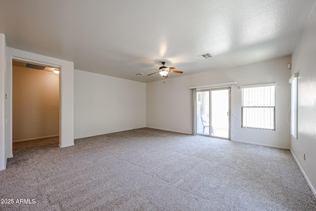5418 W Carson Rd, Laveen, AZ 85339 - spare room with a ceiling fan and carpet