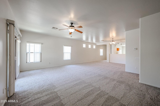 5418 W Carson Rd, Laveen, AZ 85339 - unfurnished room featuring carpet floors, plenty of natural light, and ceiling fan