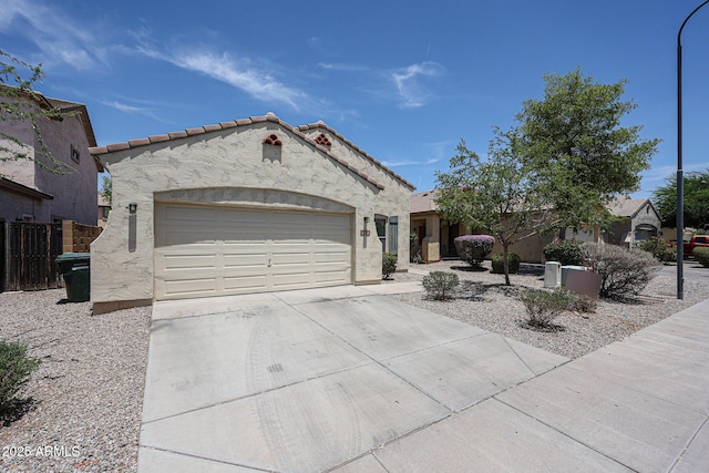 5418 W Carson Rd, Laveen, AZ 85339 - view of front of house with an attached garage, driveway, stucco siding, and a tiled roof
