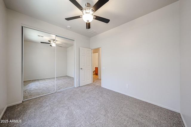 5418 W Carson Rd, Laveen, AZ 85339 - unfurnished bedroom featuring carpet flooring, a closet, and a ceiling fan
