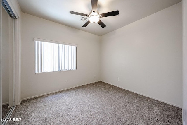 5418 W Carson Rd, Laveen, AZ 85339 - empty room featuring carpet and a ceiling fan