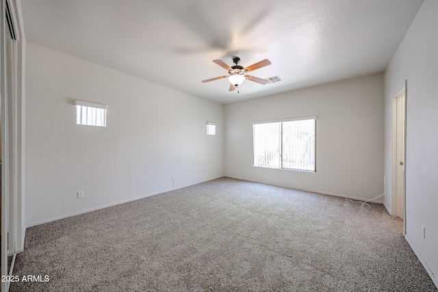 5418 W Carson Rd, Laveen, AZ 85339 - carpeted spare room featuring plenty of natural light and ceiling fan