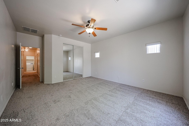 5418 W Carson Rd, Laveen, AZ 85339 - unfurnished bedroom featuring carpet, a closet, and a ceiling fan