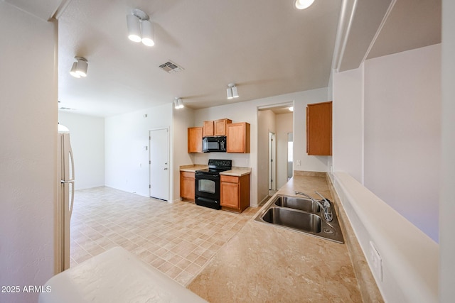 5418 W Carson Rd, Laveen, AZ 85339 - kitchen with black appliances and light countertops