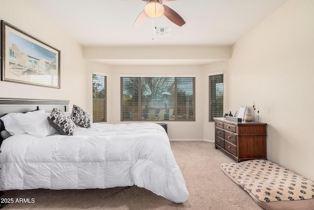 bedroom with light carpet and ceiling fan