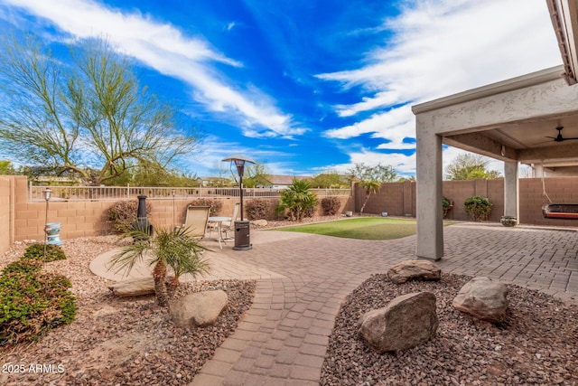 view of patio / terrace featuring ceiling fan