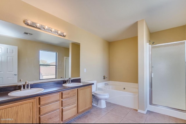 full bath featuring a stall shower, tile patterned flooring, a sink, and visible vents