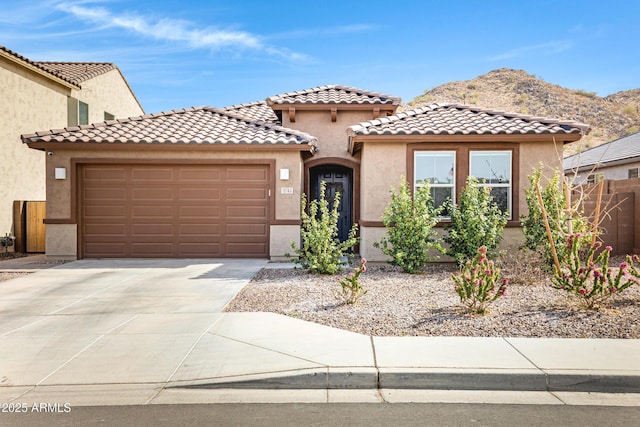 1743 W Flintlock Dr, San Tan Valley, AZ 85144 - mediterranean / spanish-style home featuring a mountain view and a garage