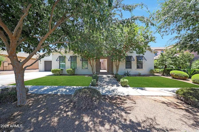 2859 E Los Altos Rd, Gilbert, AZ 85297 - obstructed view of property featuring a front yard, stucco siding, concrete driveway, and an attached garage