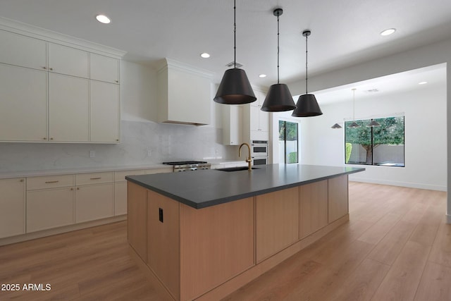 2859 E Los Altos Rd, Gilbert, AZ 85297 - kitchen featuring recessed lighting, decorative backsplash, light wood-type flooring, a kitchen island with sink, and pendant lighting