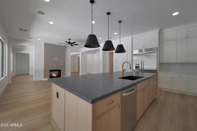 2859 E Los Altos Rd, Gilbert, AZ 85297 - kitchen with stainless steel built in fridge, light wood-type flooring, a ceiling fan, dark countertops, and recessed lighting