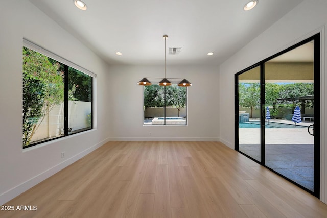 2859 E Los Altos Rd, Gilbert, AZ 85297 - unfurnished room with healthy amount of natural light, light wood-style floors, and recessed lighting