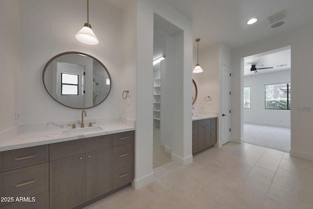 2859 E Los Altos Rd, Gilbert, AZ 85297 - full bathroom with two vanities, ceiling fan, and a spacious closet