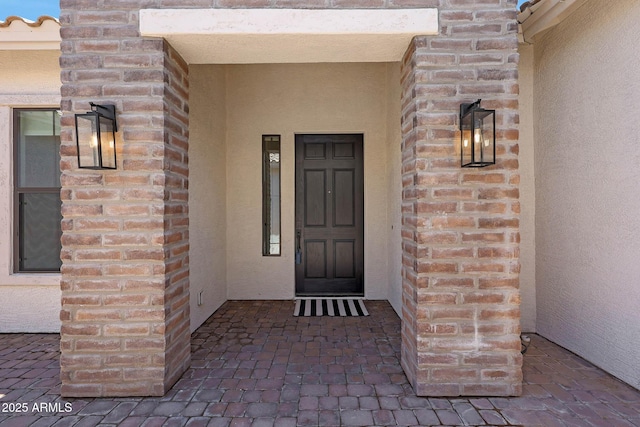 2859 E Los Altos Rd, Gilbert, AZ 85297 - view of exterior entry with stucco siding and brick siding