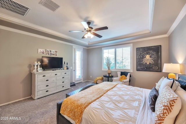 carpeted bedroom featuring crown molding, visible vents, and baseboards