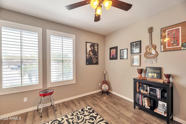 miscellaneous room featuring ceiling fan, wood finished floors, and baseboards