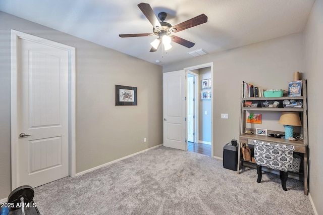home office with baseboards, a ceiling fan, visible vents, and carpet floors