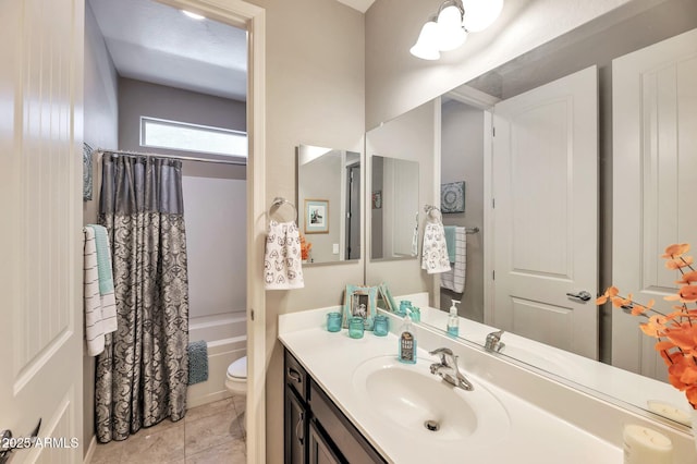 full bathroom with tile patterned floors, toilet, shower / bathtub combination with curtain, and vanity