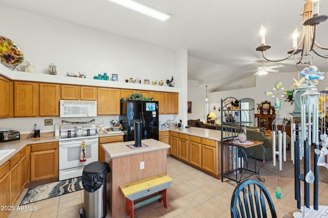 kitchen with brown cabinetry, white appliances, light countertops, and a kitchen island