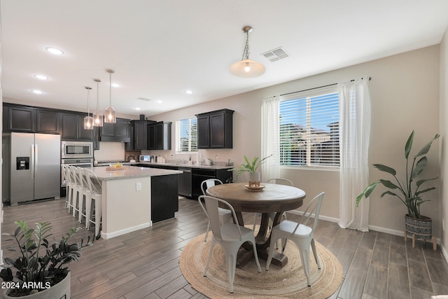 dining area featuring dark hardwood / wood-style flooring