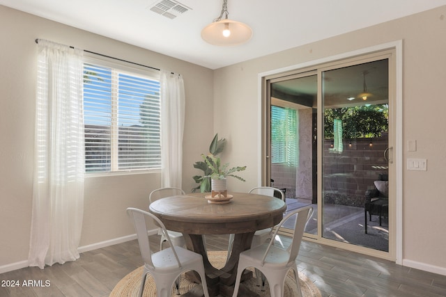 dining area with wood-type flooring