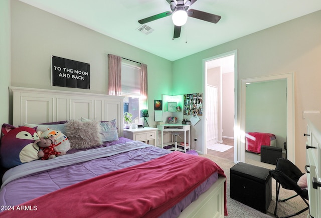 bedroom featuring light colored carpet and ceiling fan