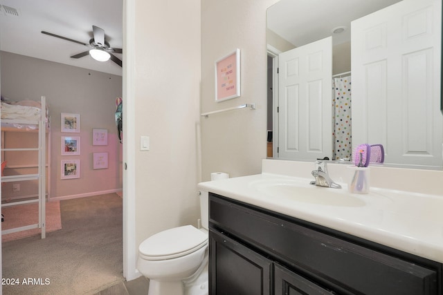 bathroom featuring ceiling fan, vanity, and toilet