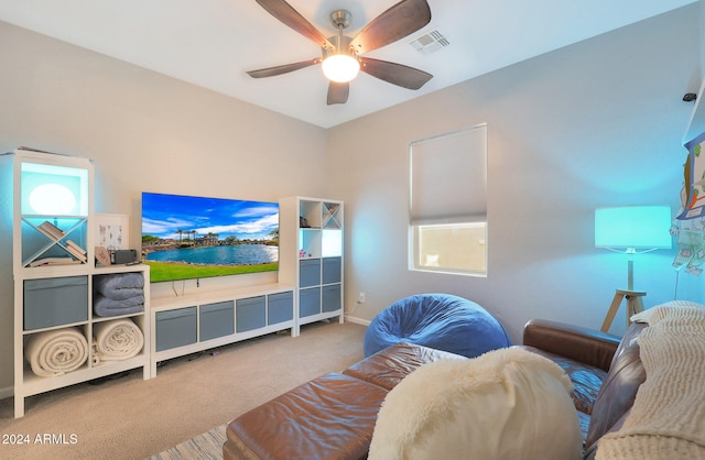 carpeted living room featuring ceiling fan and plenty of natural light