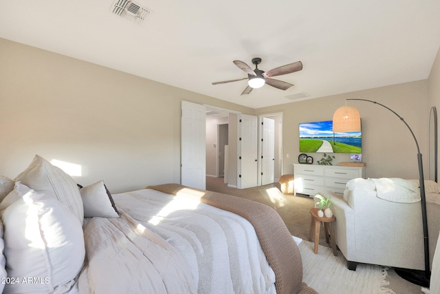 carpeted bedroom with ceiling fan