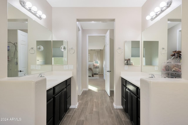 bathroom featuring vanity and hardwood / wood-style flooring