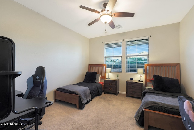 carpeted bedroom with lofted ceiling and ceiling fan