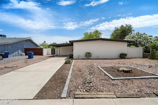 1939 E Alameda Dr, Tempe, AZ 85282 - mid-century inspired home featuring a carport and concrete driveway