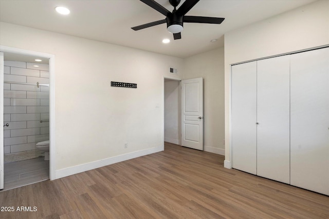 1939 E Alameda Dr, Tempe, AZ 85282 - unfurnished bedroom featuring wood finished floors, baseboards, ensuite bathroom, recessed lighting, and a closet