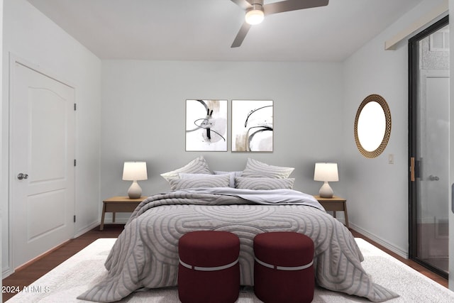 bedroom with ceiling fan and dark hardwood / wood-style flooring