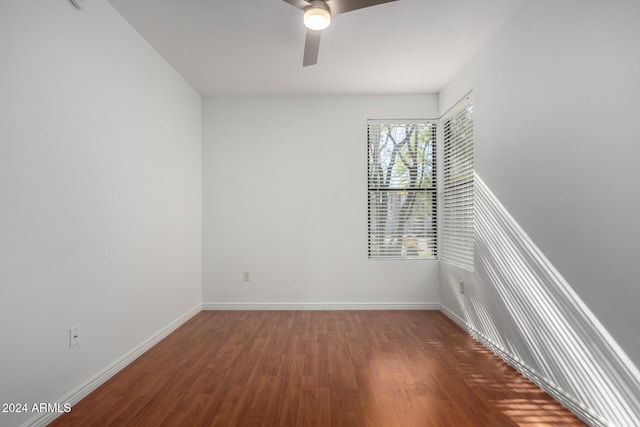 spare room with ceiling fan and wood-type flooring