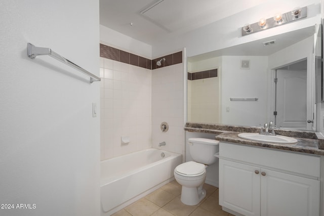 full bathroom with tile patterned floors, tiled shower / bath combo, toilet, and vanity