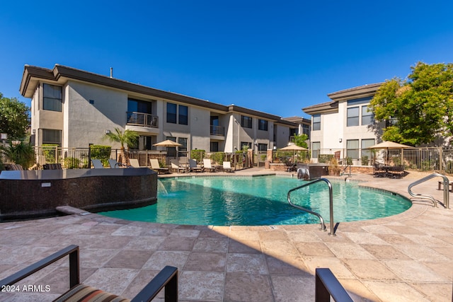 view of pool featuring a patio area