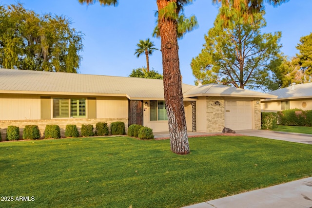 single story home with a front yard and a garage